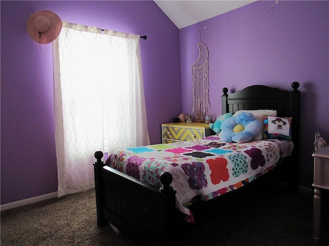 bedroom with carpet flooring and lofted ceiling