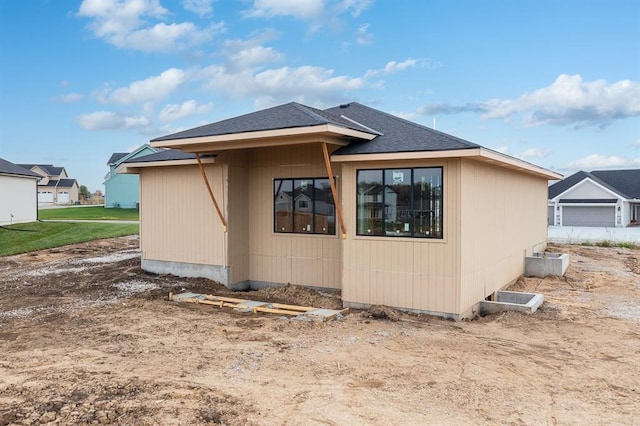 view of property exterior with a garage