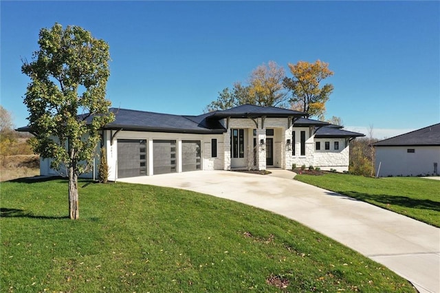 3411 S Mize Ridge Ct, Independence, MO 64057 - prairie-style house featuring an attached garage, driveway, a front yard, and stone siding