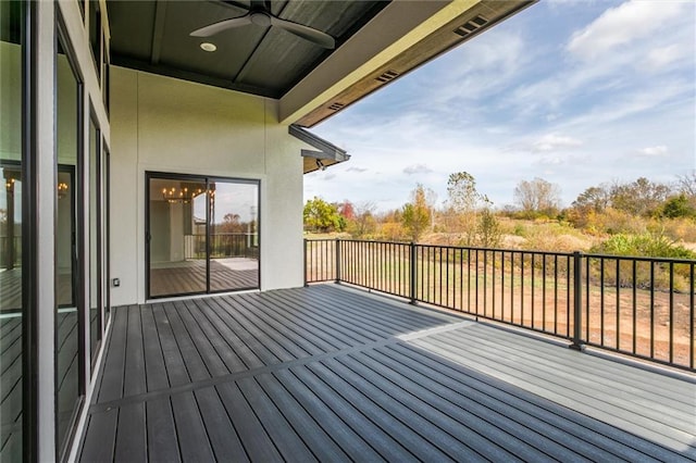 wooden terrace featuring ceiling fan