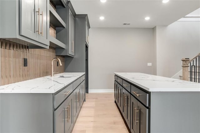 kitchen with gray cabinets and sink