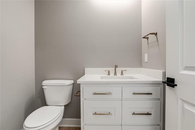 3411 S Mize Ridge Ct, Independence, MO 64057 - bathroom featuring vanity, toilet, and wood finished floors