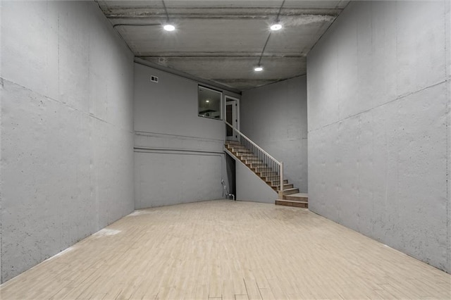 basement featuring wood-type flooring