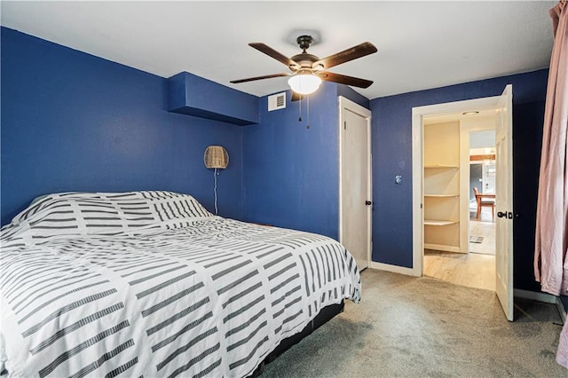 bedroom featuring a closet, ceiling fan, and carpet floors