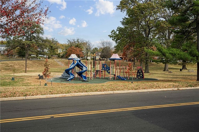 view of jungle gym featuring a lawn