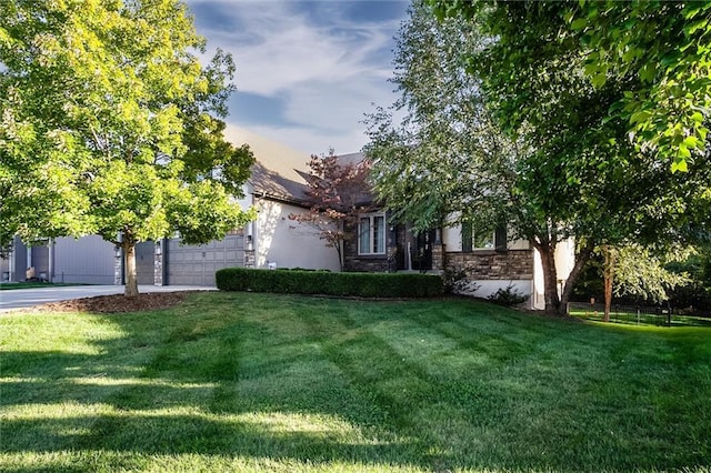 view of property hidden behind natural elements featuring a yard
