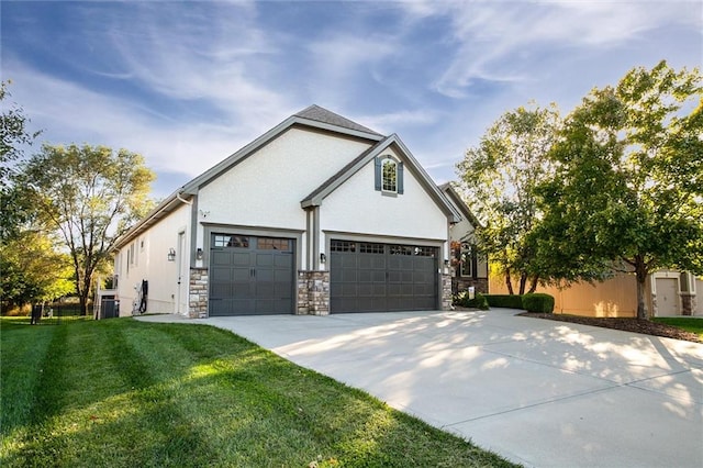 view of front of property with a garage, a shed, and a front lawn