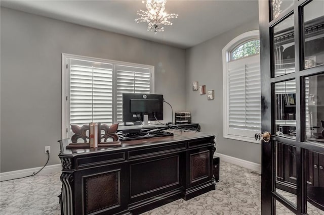 home office featuring a chandelier