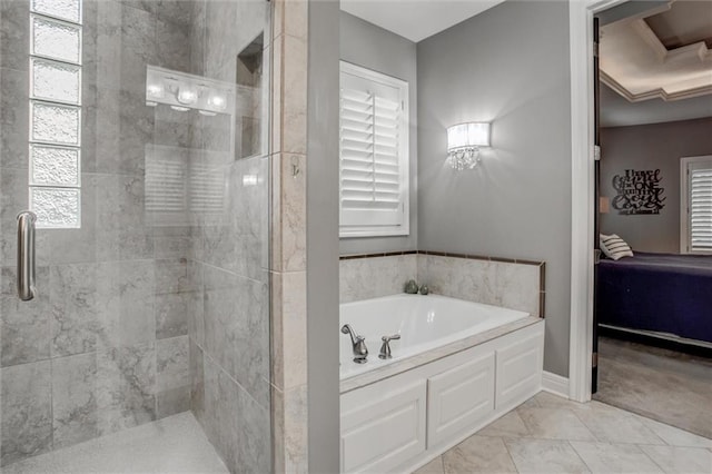 bathroom with tile patterned floors and independent shower and bath
