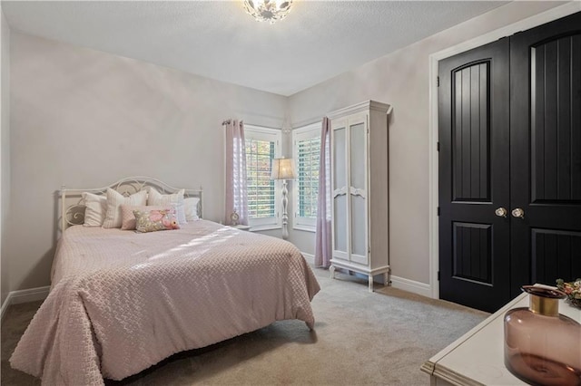 bedroom featuring light colored carpet