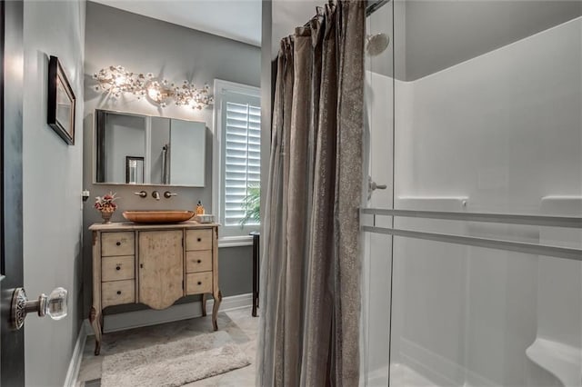 bathroom with vanity and curtained shower