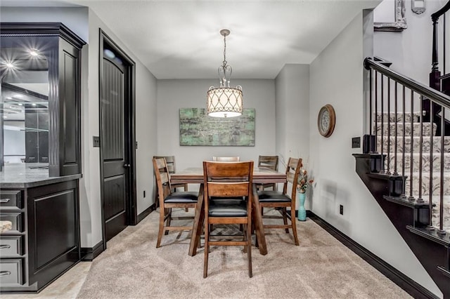 dining space with light colored carpet