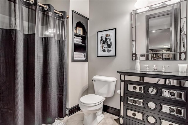 bathroom with vanity, walk in shower, tile patterned floors, and toilet