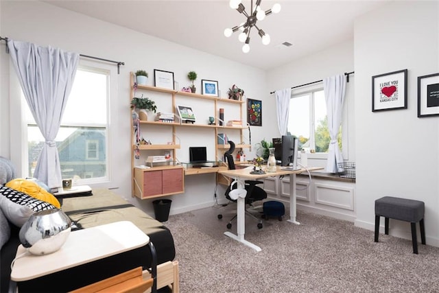 carpeted office space with an inviting chandelier