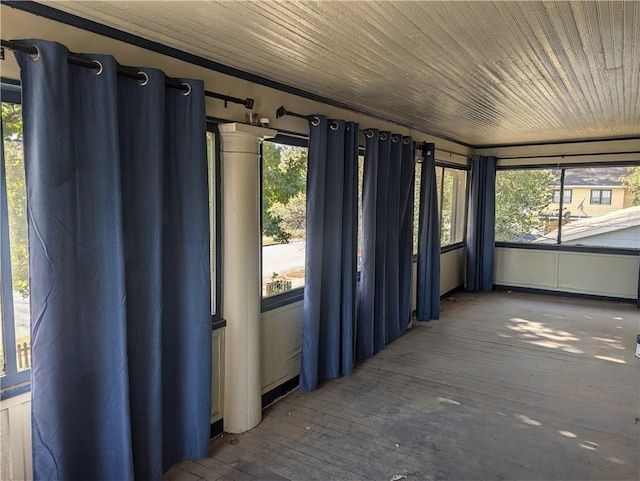 unfurnished sunroom with a wealth of natural light