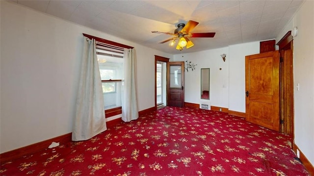 612 W Cherry St, Nevada, MO 64772 - unfurnished room featuring carpet, ceiling fan, and baseboards