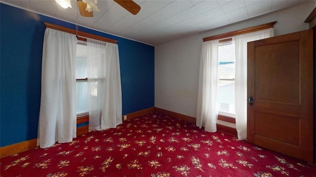 612 W Cherry St, Nevada, MO 64772 - carpeted spare room featuring ceiling fan and baseboards