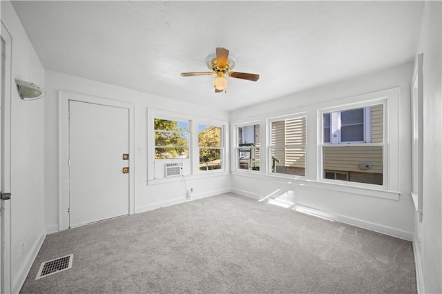 interior space with ceiling fan