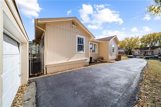 view of side of home with a garage