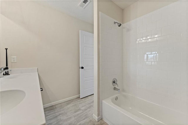 bathroom featuring shower / bathing tub combination and vanity