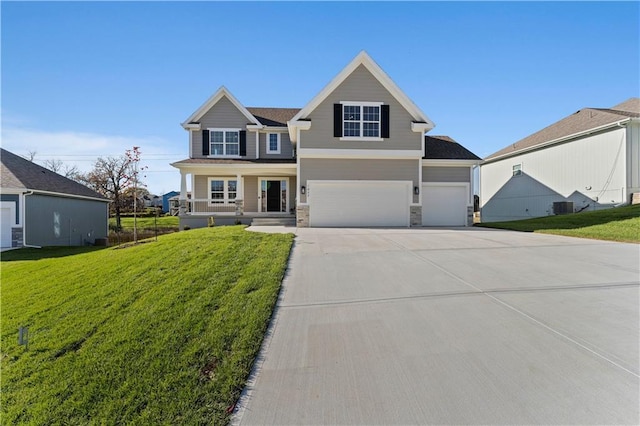 view of front facade featuring covered porch, a front yard, central AC, and a garage