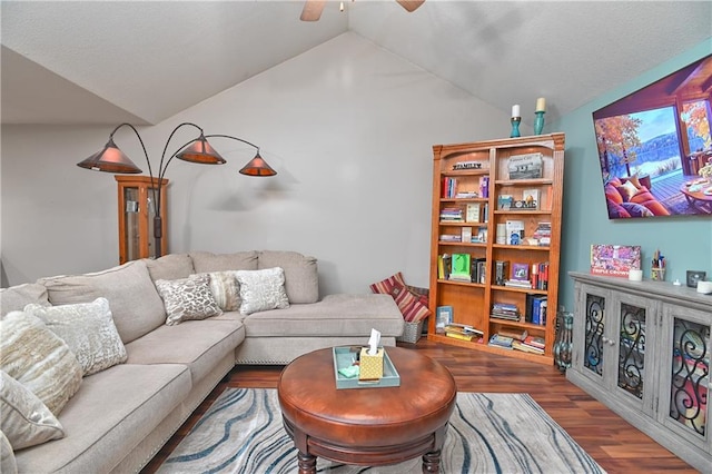 living room with lofted ceiling, hardwood / wood-style floors, and ceiling fan