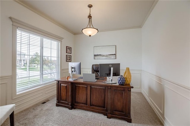 office with a wealth of natural light, light colored carpet, and crown molding