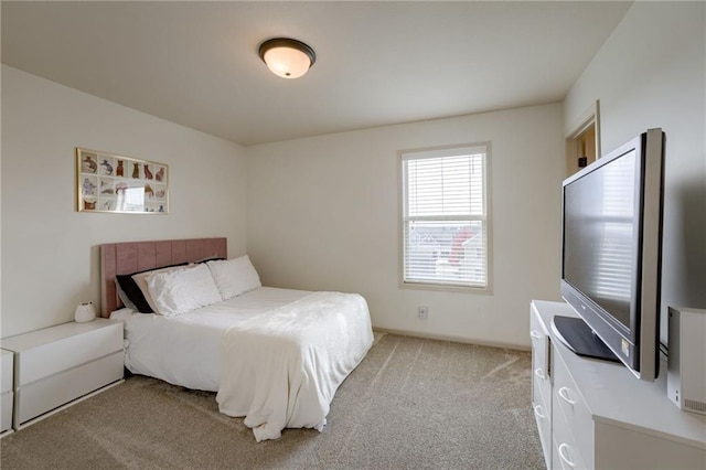 bedroom featuring light colored carpet