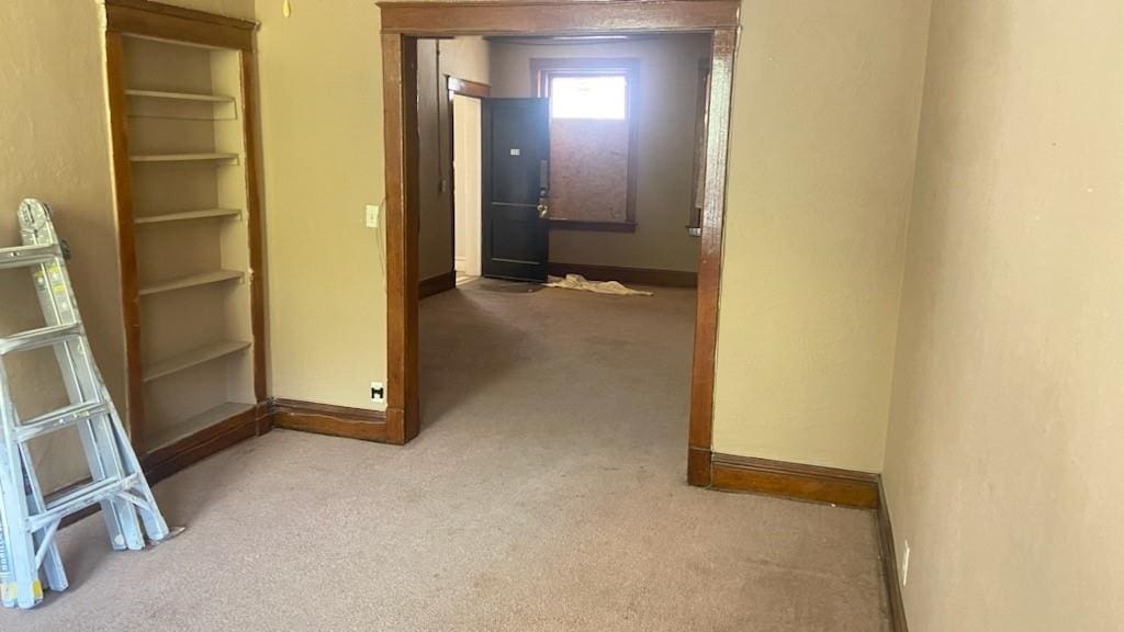 hallway with carpet flooring