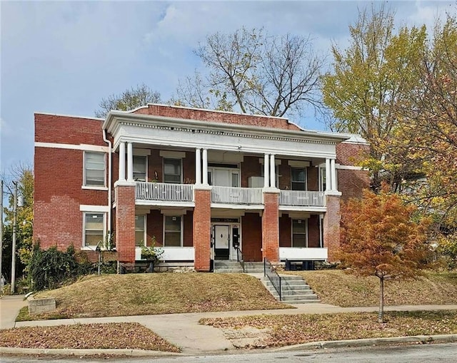 2542 Benton Blvd, Kansas City, MO 64127 - view of front facade featuring a balcony