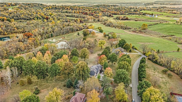 birds eye view of property with a rural view