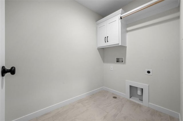 laundry area featuring electric dryer hookup, washer hookup, and cabinets