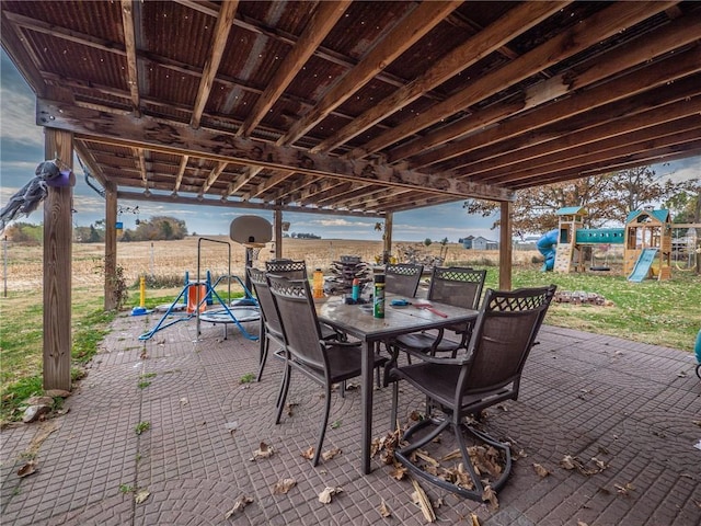 100 S Cherry St, Clearmont, MO 64431 - view of patio / terrace with a playground and outdoor dining space