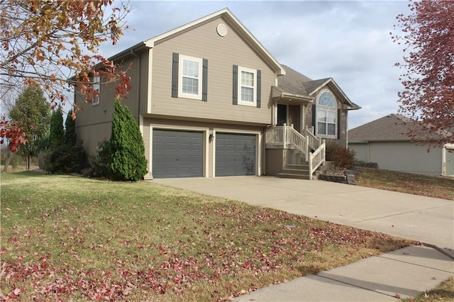 view of front of property with a garage and a front lawn