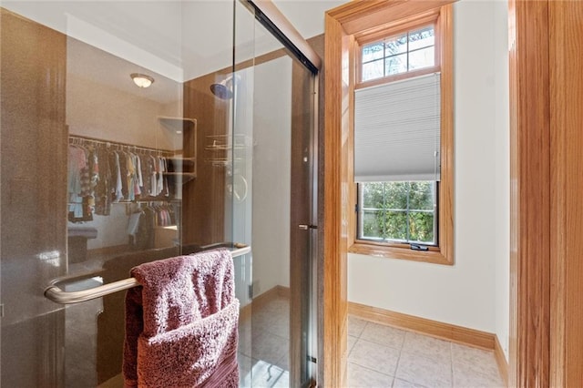 bathroom with tile patterned floors and an enclosed shower