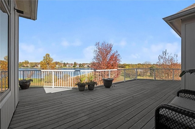 wooden deck featuring a water view