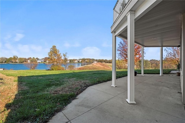 view of yard with a patio area and a water view