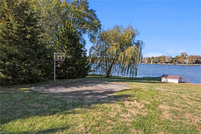 exterior space with a yard and a water view