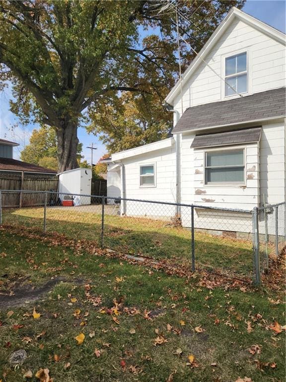 view of property exterior with a lawn