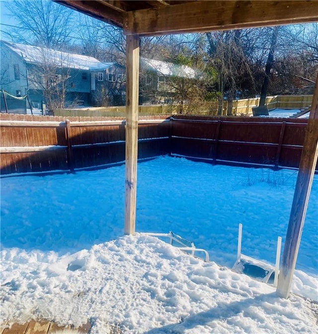 view of snow covered pool