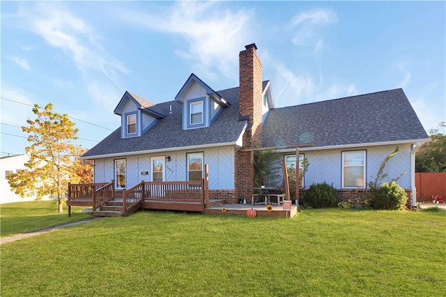 view of front of home with a wooden deck and a front yard