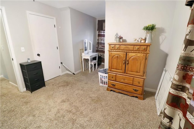 interior space featuring light colored carpet