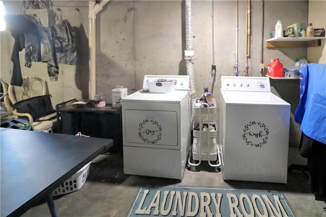 clothes washing area with washer and dryer