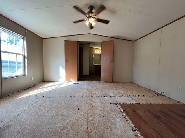 spare room with ceiling fan and lofted ceiling