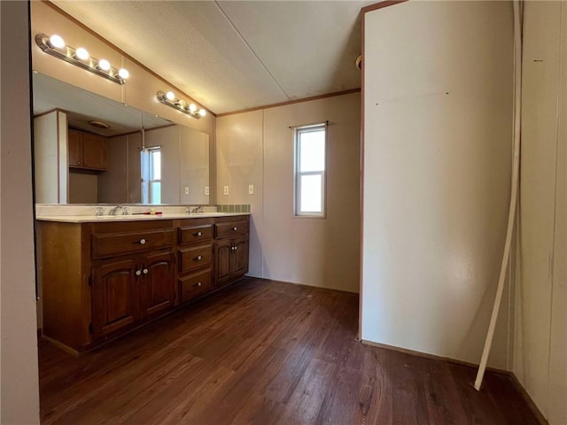 bathroom with vanity, a textured ceiling, and hardwood / wood-style floors