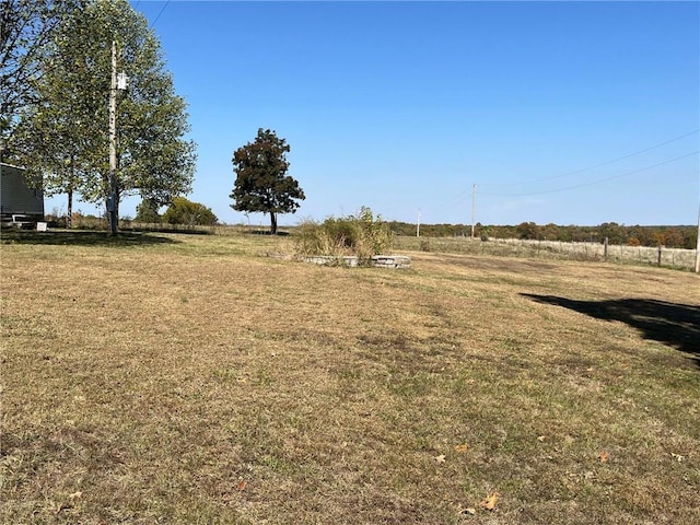 view of yard with a rural view