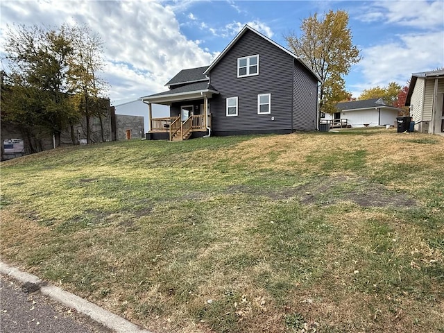 rear view of house with a yard