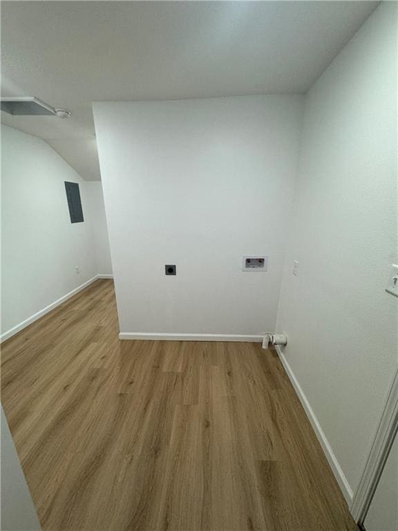 washroom with washer hookup, hookup for an electric dryer, and light wood-type flooring