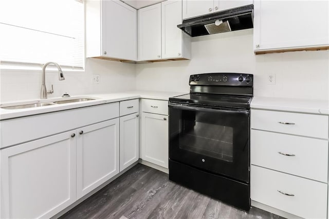 kitchen with black electric range, sink, dark hardwood / wood-style floors, and white cabinets