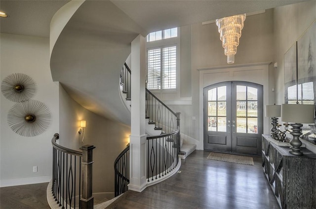 16904 Parkhill St, Overland Park, KS 66221 - entryway featuring french doors, a chandelier, wood finished floors, and stairs